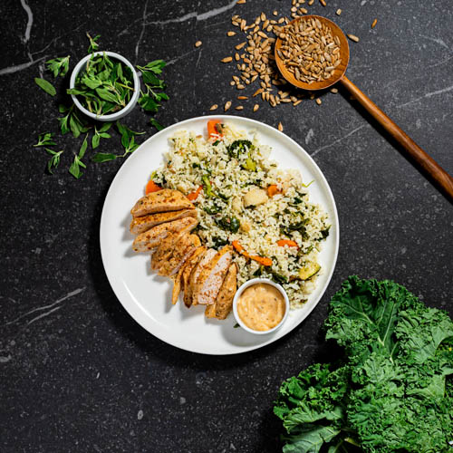 Cajun Chicken with Garlic Rice Nest and Kale